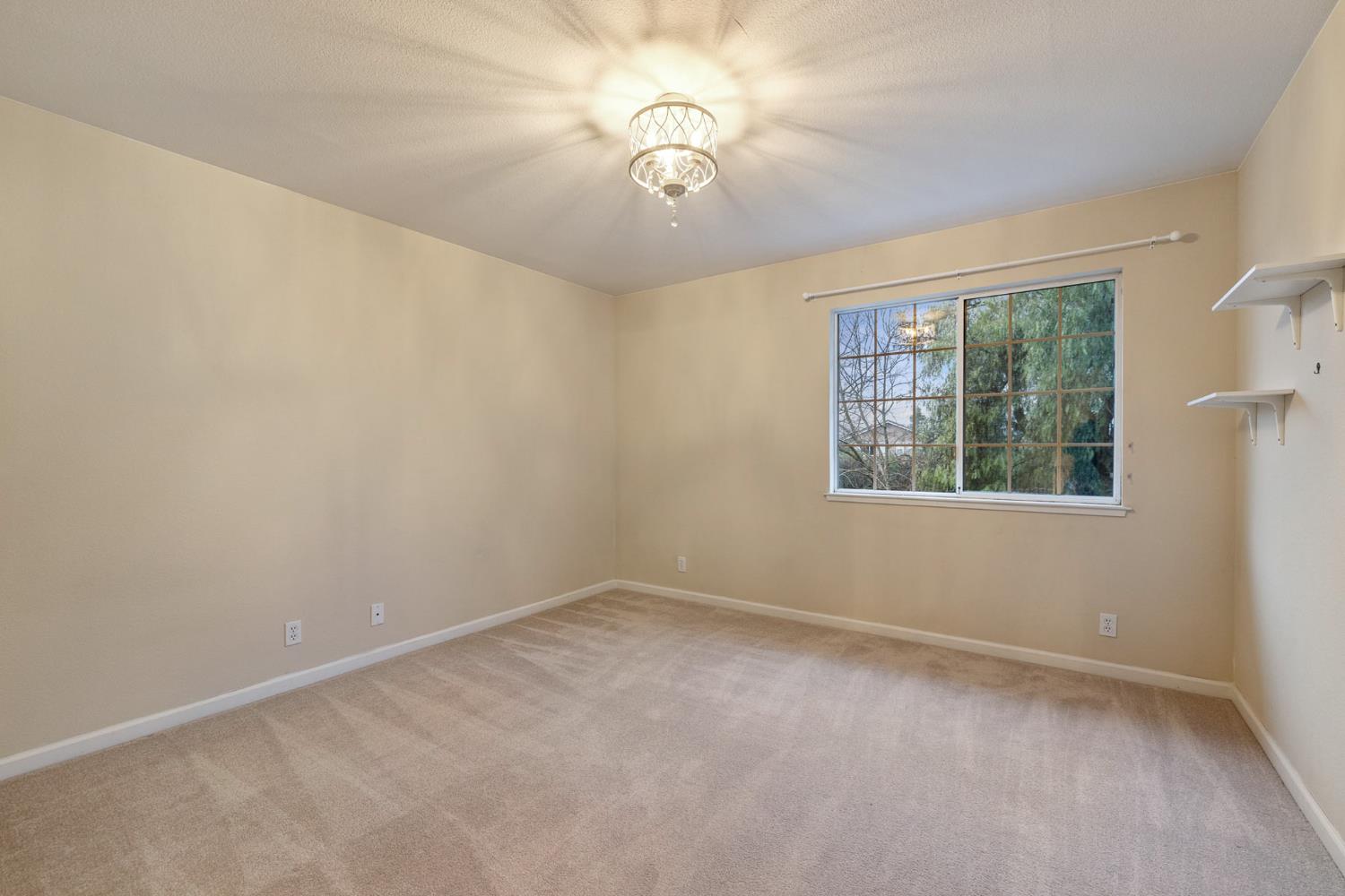 2309 O'Keeffe Pl. Davis, CA 95618 - Photo 31 of 57 a view of an empty room with a window