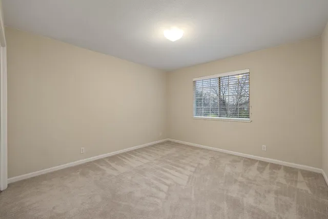 a bathroom with a double vanity sink mirror and toilet