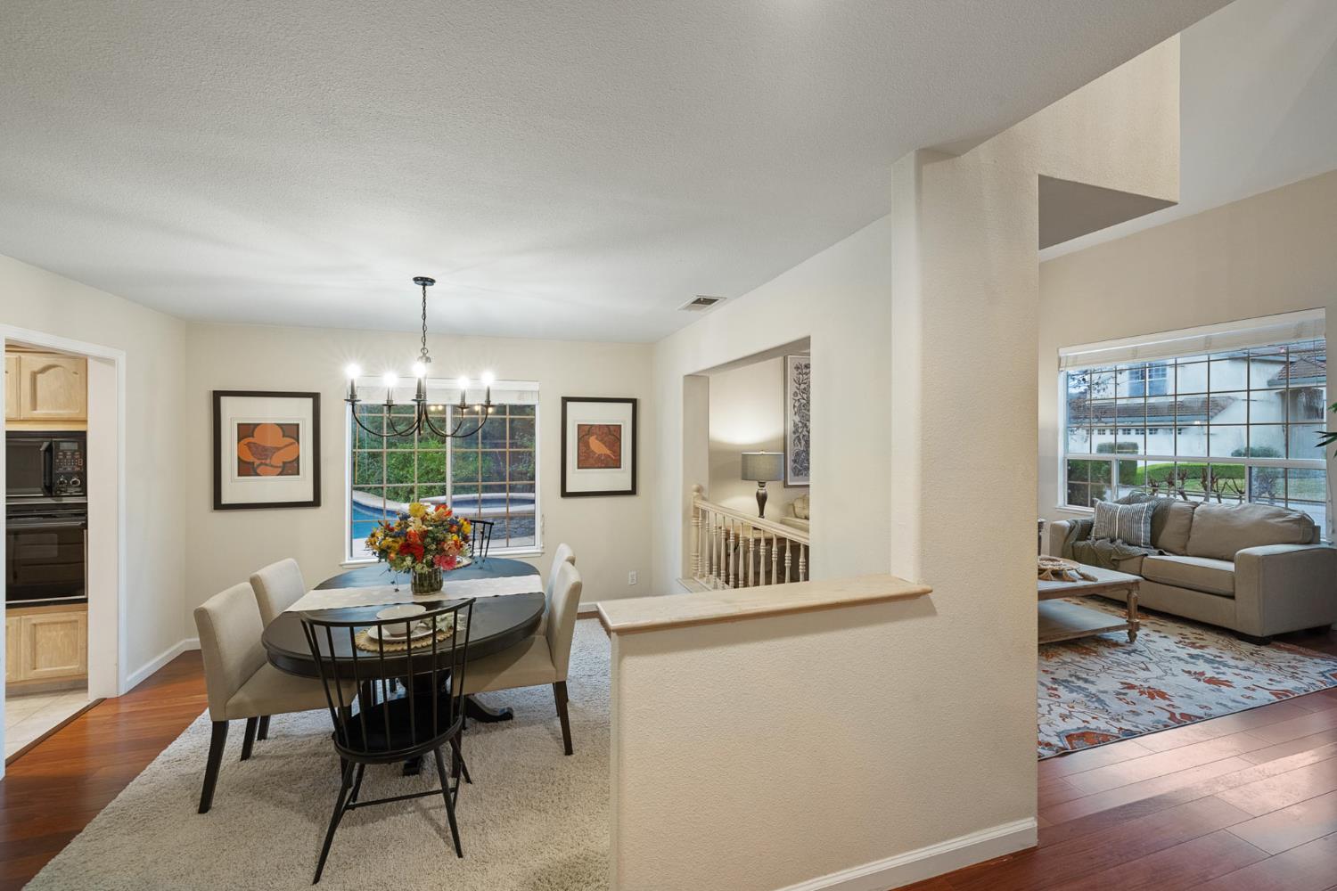 2309 O'Keeffe Pl. Davis, CA 95618 - Photo 7 of 57 a living room with furniture and a wooden floor