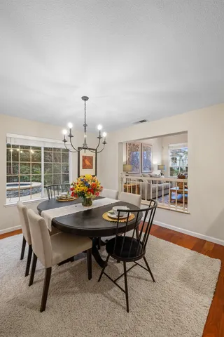 a view of a dining room with furniture window and outside view