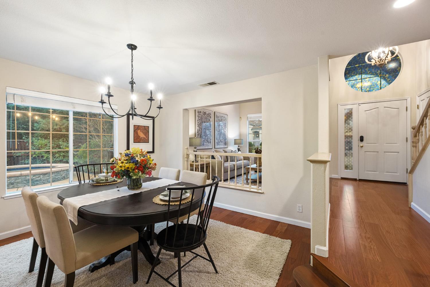2309 O'Keeffe Pl. Davis, CA 95618 - Photo 9 of 57 a view of a dining room with furniture window and wooden floor