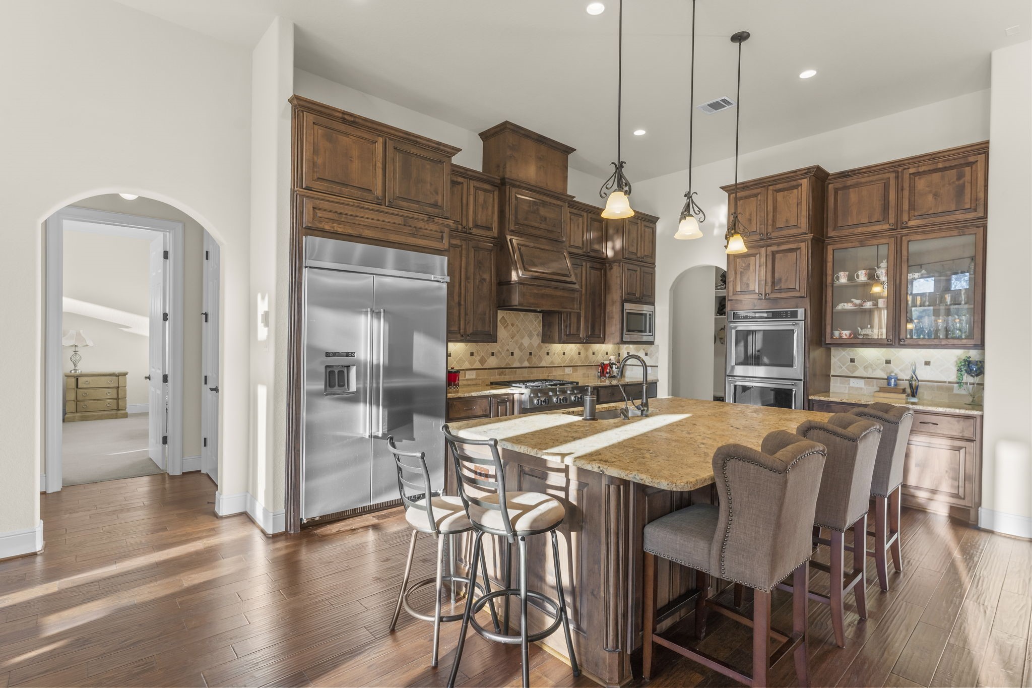 4022 Sabine Valley Trail Spring, TX 77386 - Photo 16 of 50 The kitchen is fit for the finest chef with large island, built in refrigerator, double ovens and gas cooktop.