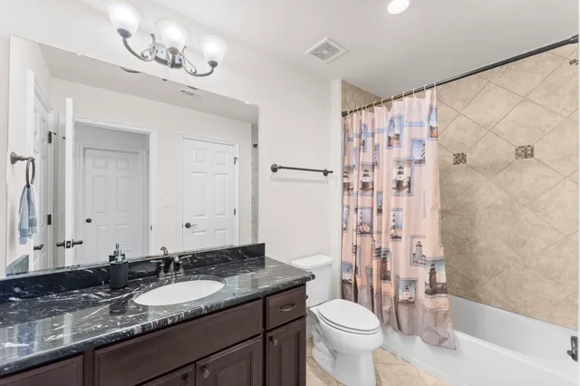 a view of a house with a backyard and a patio