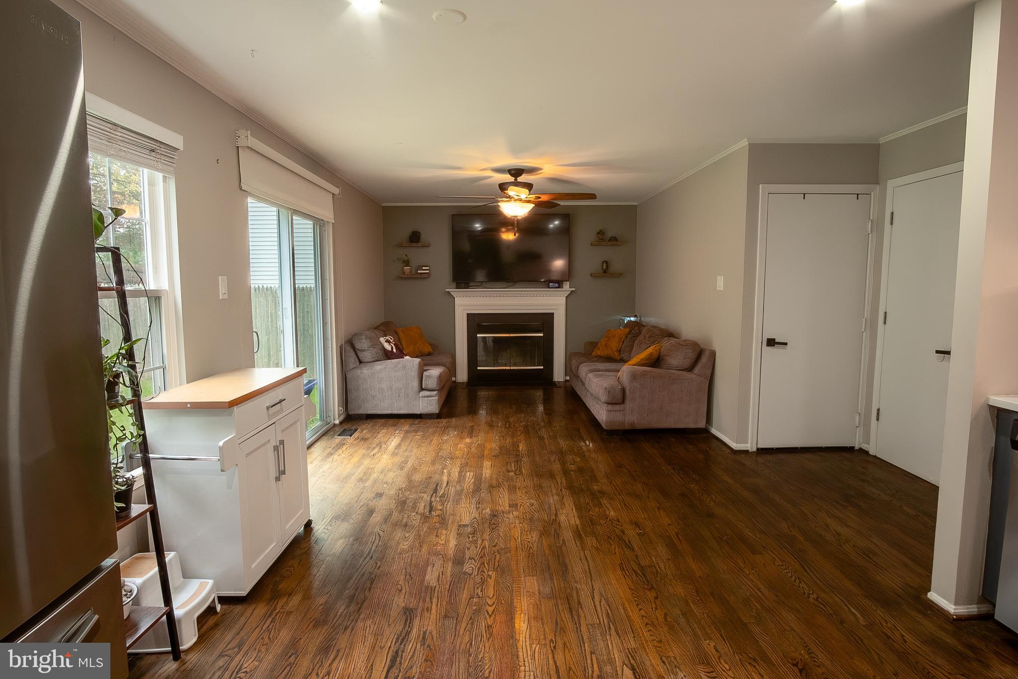 6621 Gooseander Court Frederick, MD 21703 - Photo 19 of 42 a living room with furniture and a fireplace