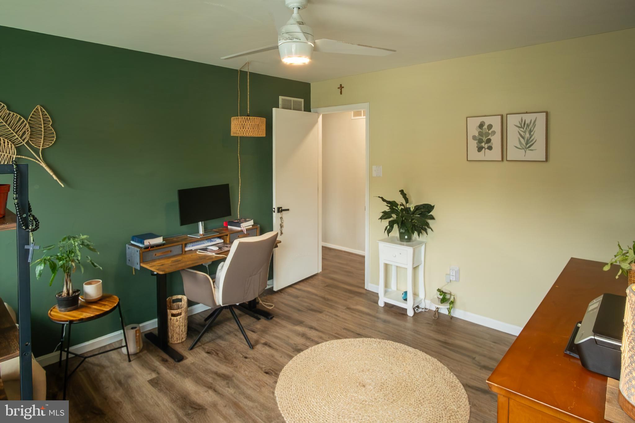 6621 Gooseander Court Frederick, MD 21703 - Photo 28 of 42 a workspace with furniture and wooden floor