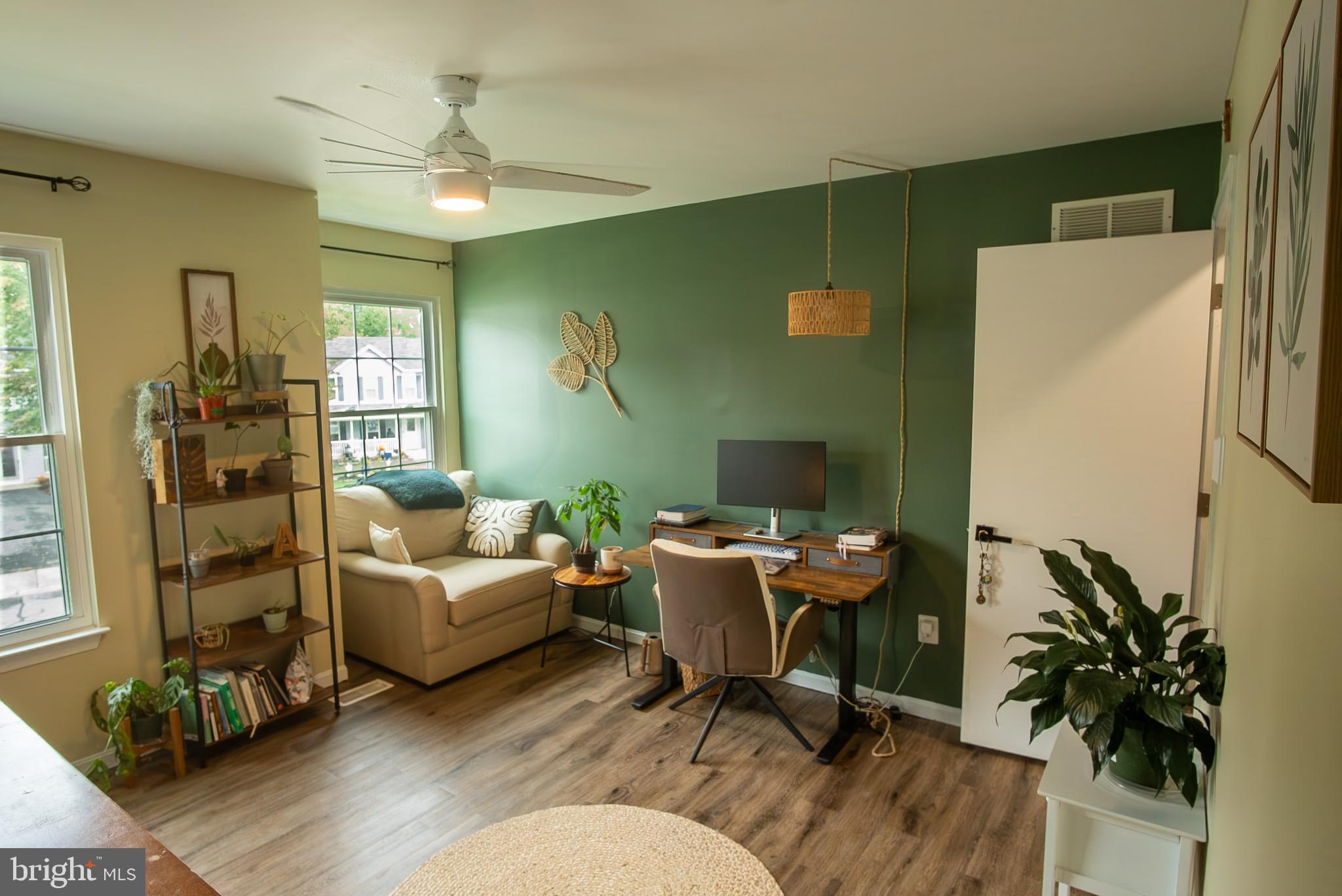 6621 Gooseander Court Frederick, MD 21703 - Photo 29 of 42 a living room with furniture and a window