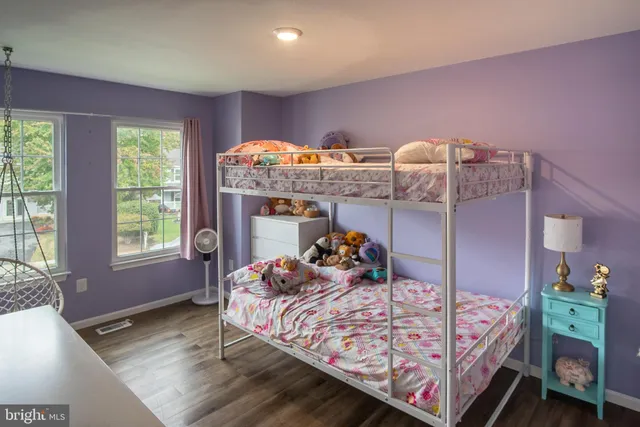 a bedroom with bed and a window