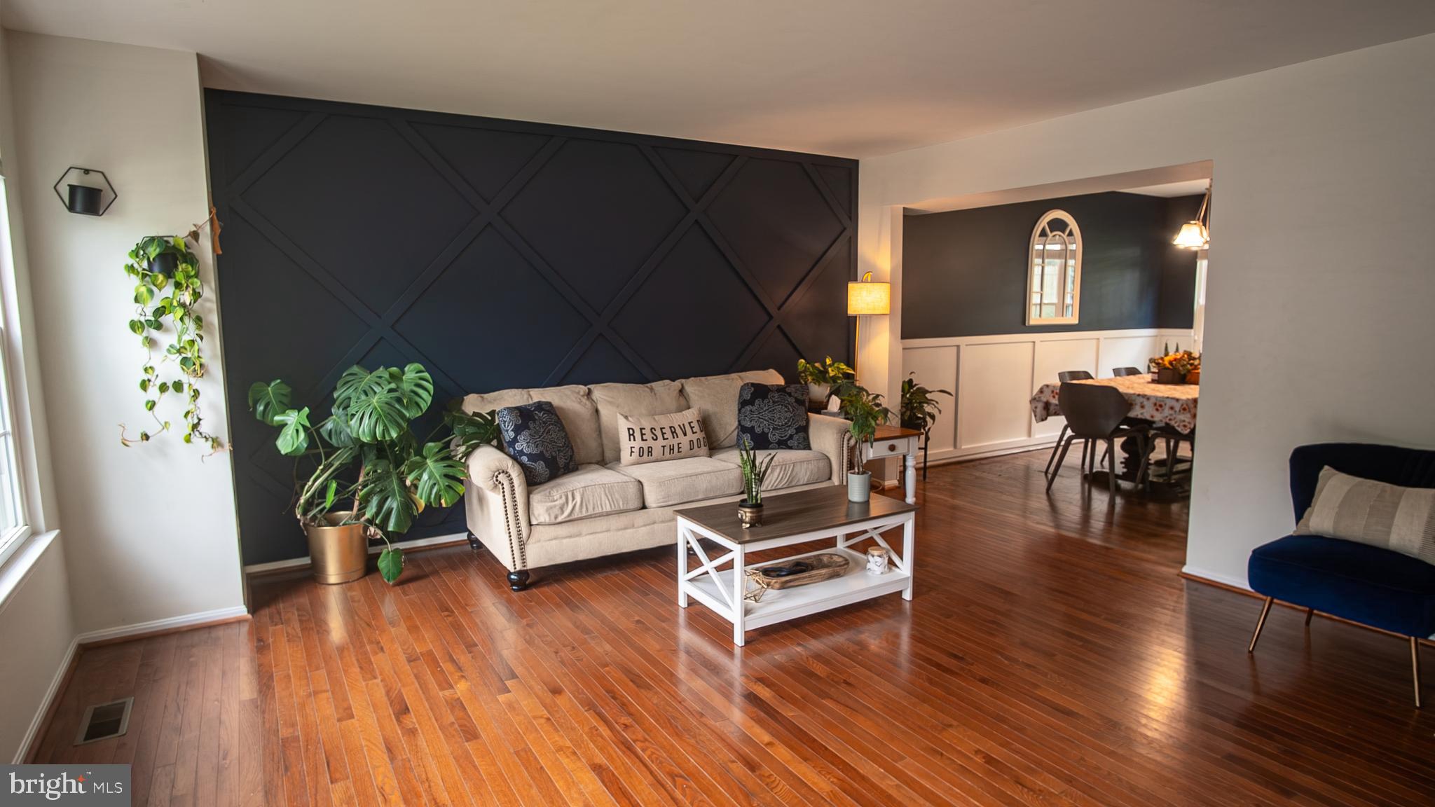 6621 Gooseander Court Frederick, MD 21703 - Photo 3 of 42 a living room with furniture and a wooden floor