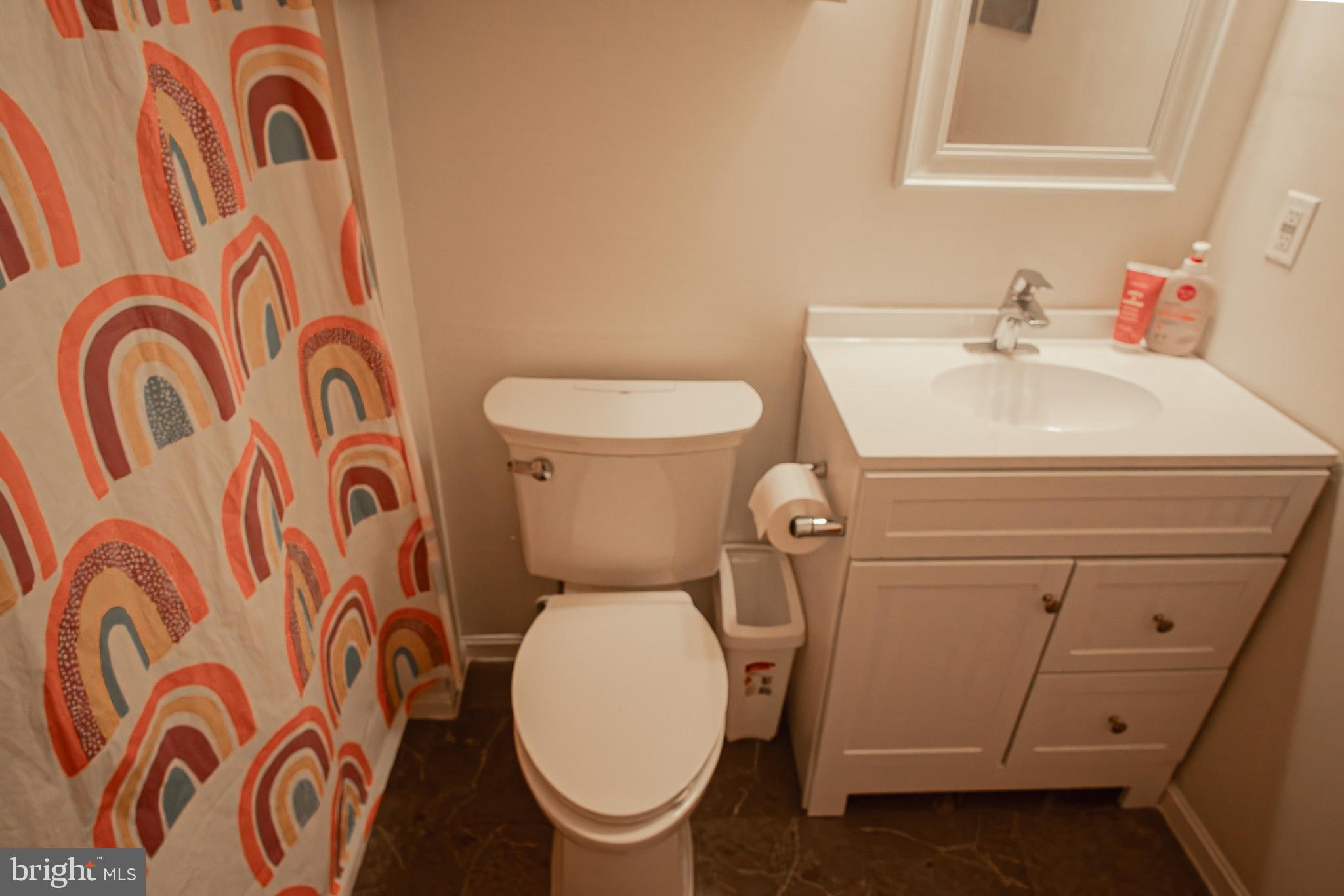 6621 Gooseander Court Frederick, MD 21703 - Photo 32 of 42 a bathroom with a toilet and a sink