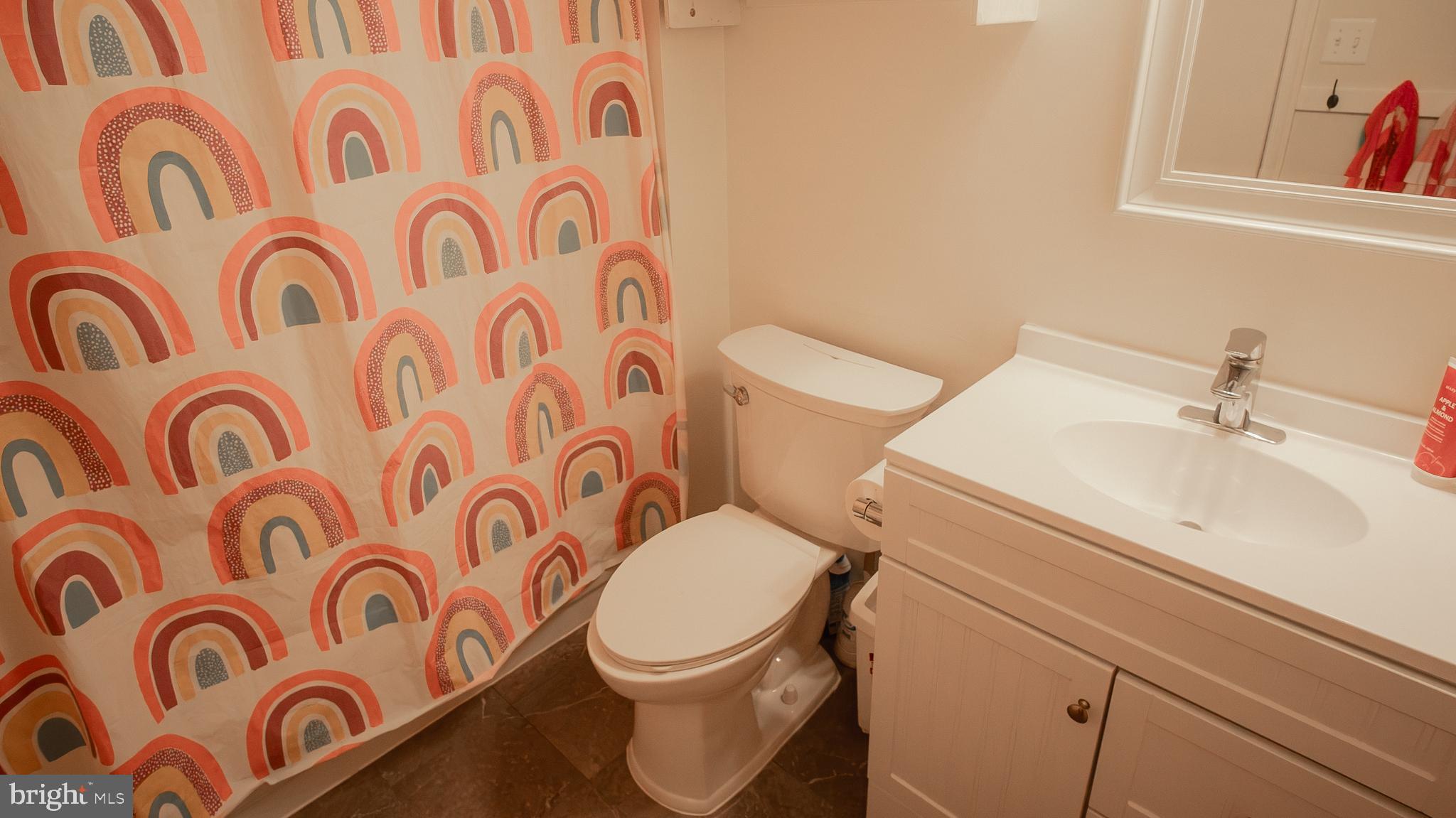 6621 Gooseander Court Frederick, MD 21703 - Photo 33 of 42 a white toilet sitting next to a bathroom sink