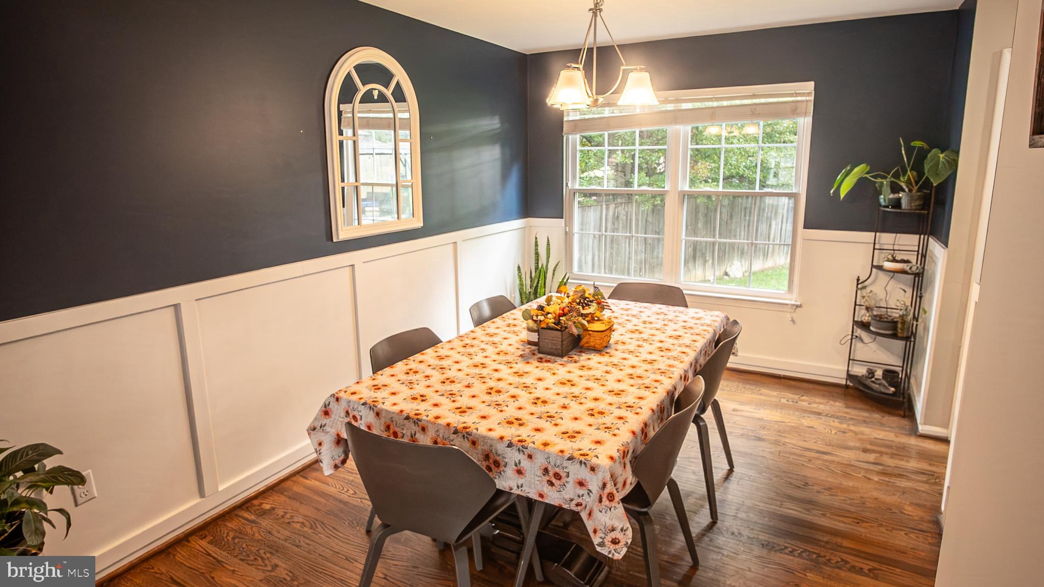 6621 Gooseander Court Frederick, MD 21703 - Photo 9 of 42 a view of a dining room with furniture window and wooden floor