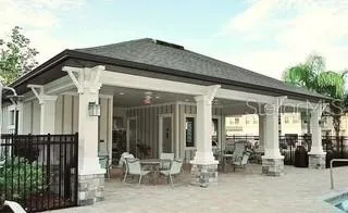 a blue bench sitting in front of a building