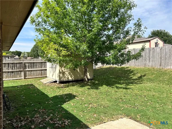 a view of a backyard with a garden