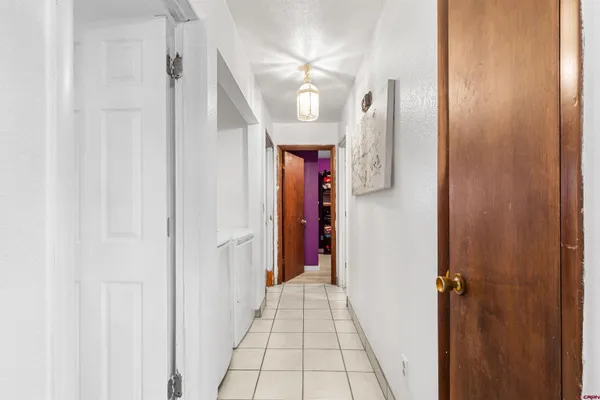 a bathroom with a sink a toilet and shower curtain