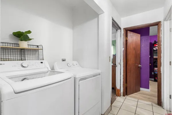 a bedroom with a bed and a desk