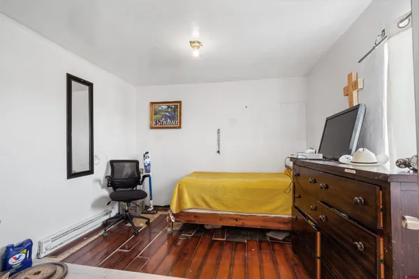 a bedroom with furniture and a bed