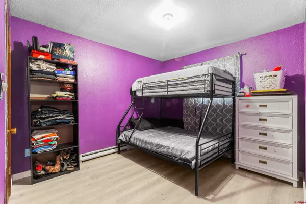 a bedroom with a bed window and a walk in closet