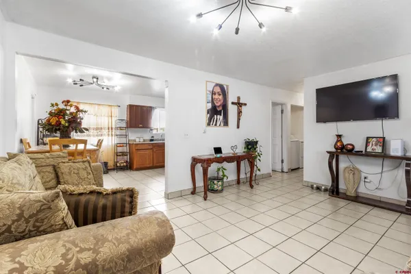 a living room with furniture and a flat screen tv