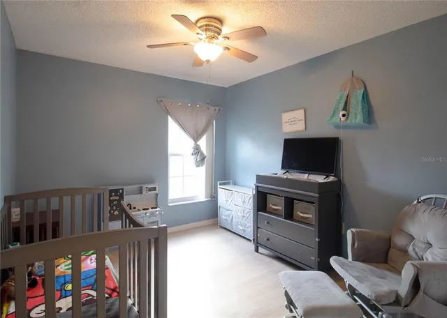 a bedroom with furniture and a fireplace