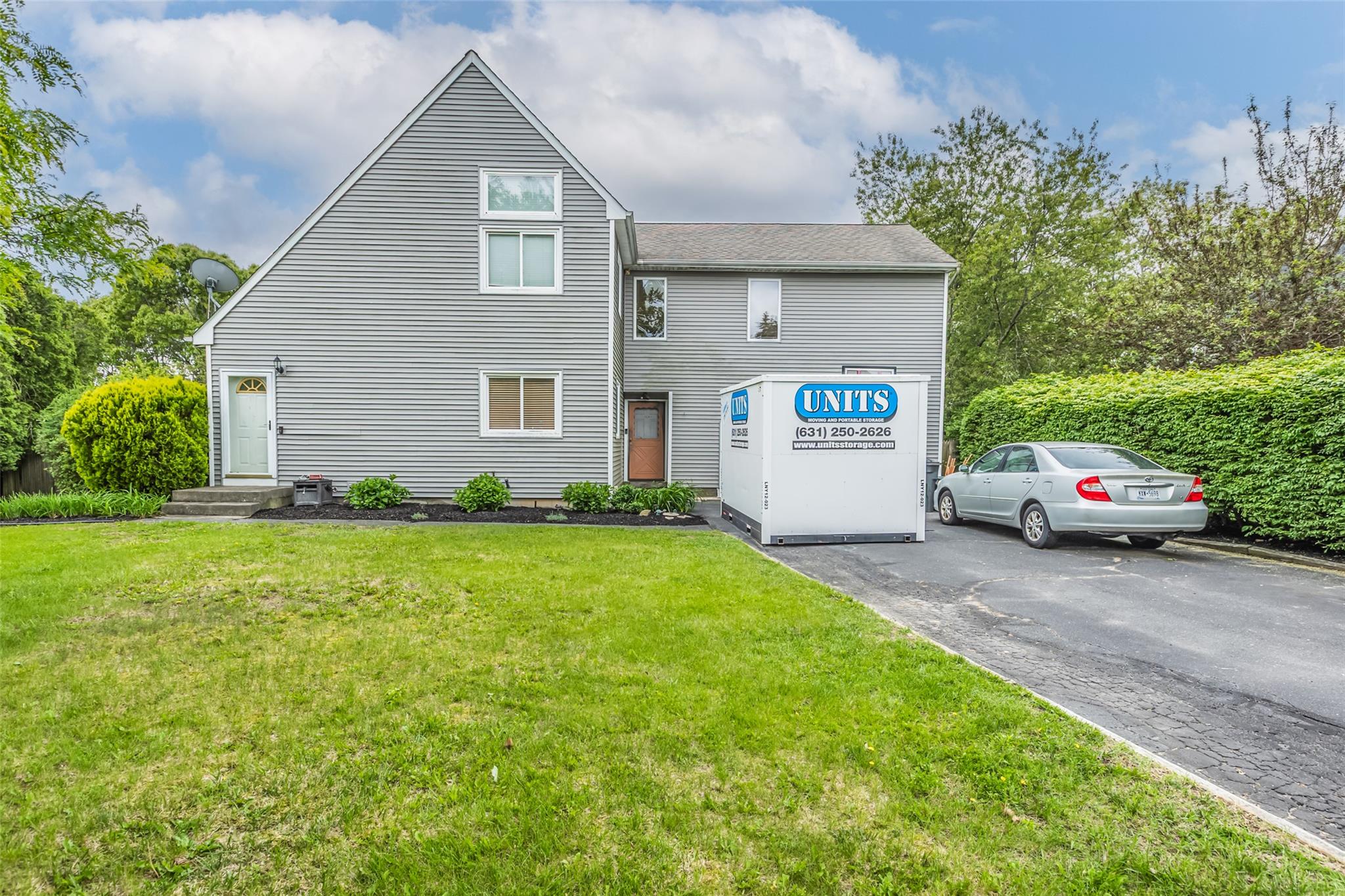 233 Arrowhead Avenue Riverhead, NY 11901 - Photo 1 of 1 a house view with a garden space