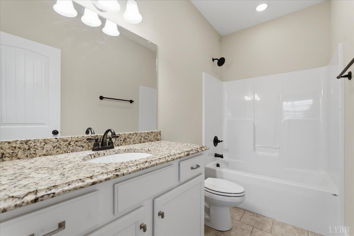 509 Cornerstone Street Lynchburg, VA 24502 - Photo 13 of 56 a bathroom with a granite countertop sink toilet and shower
