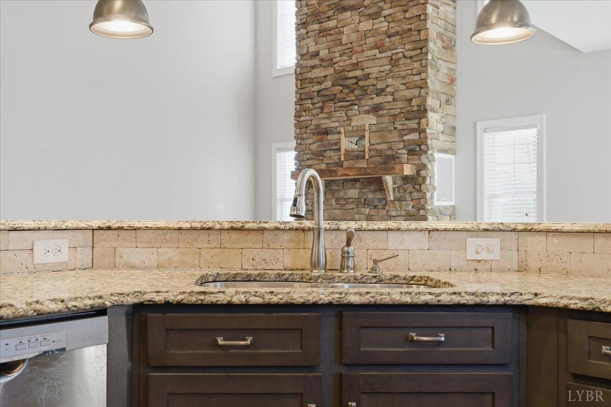 509 Cornerstone Street Lynchburg, VA 24502 - Photo 19 of 56 a view of a kitchen with granite countertop a sink and a stove