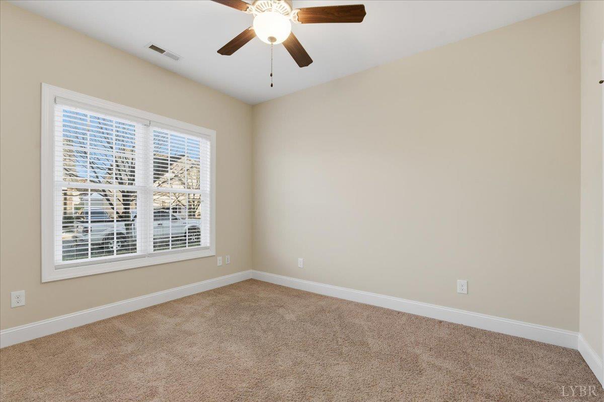 509 Cornerstone Street Lynchburg, VA 24502 - Photo 30 of 56 an empty room with a window and a ceiling fan