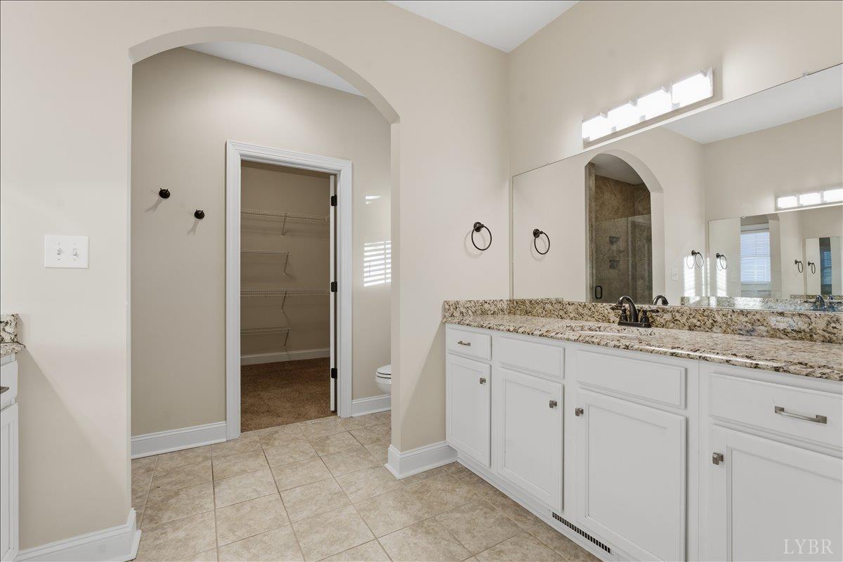 509 Cornerstone Street Lynchburg, VA 24502 - Photo 35 of 56 a bathroom with a granite countertop sink and a mirror