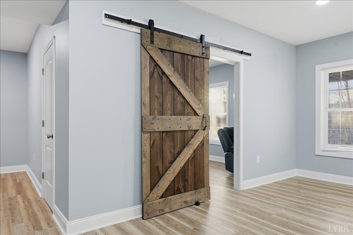 509 Cornerstone Street Lynchburg, VA 24502 - Photo 54 of 56 a view of hallway with stairs and wooden floor
