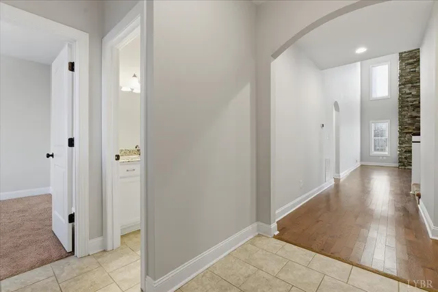 a view of entryway with wooden floor and a front door