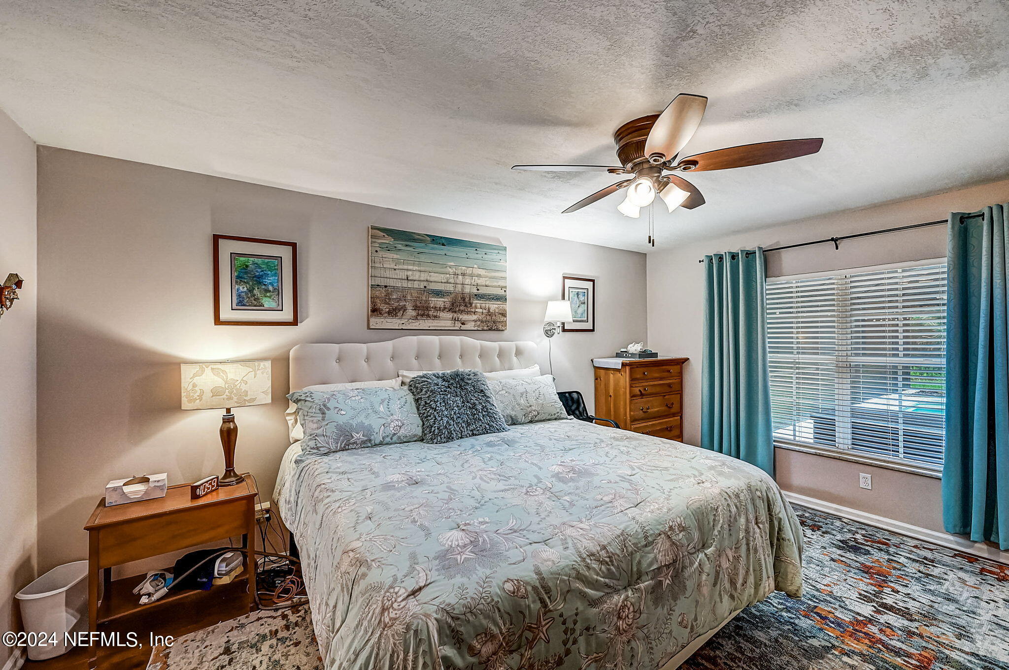 1130 Linwood Loop St. Johns, FL 32259 - Photo 13 of 34 a bedroom with a large bed and a chandelier