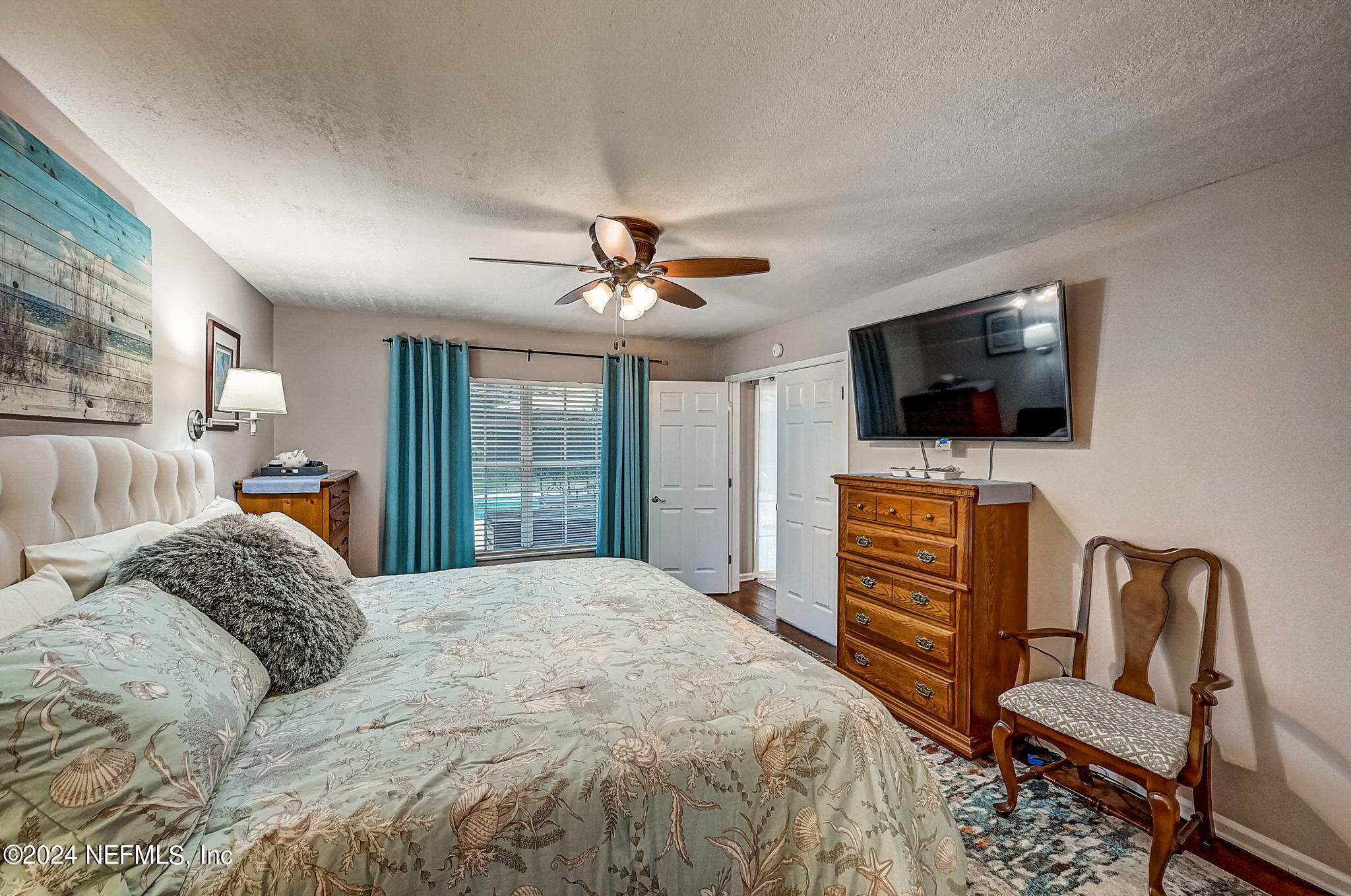 1130 Linwood Loop St. Johns, FL 32259 - Photo 14 of 34 a bedroom with a bed and a flat screen tv