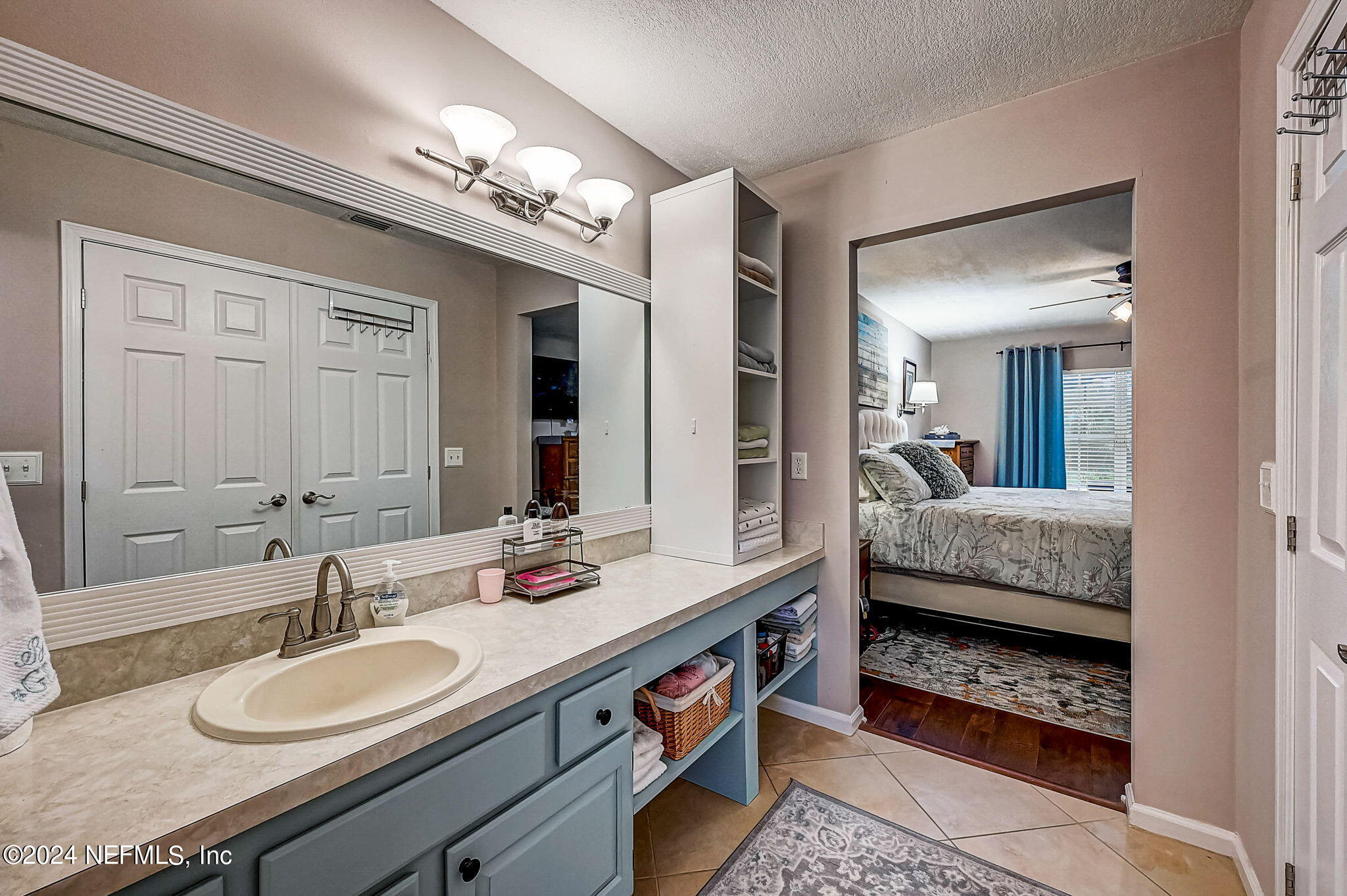 1130 Linwood Loop St. Johns, FL 32259 - Photo 19 of 34 a en suite bathroom with a double vanity sink and a mirror