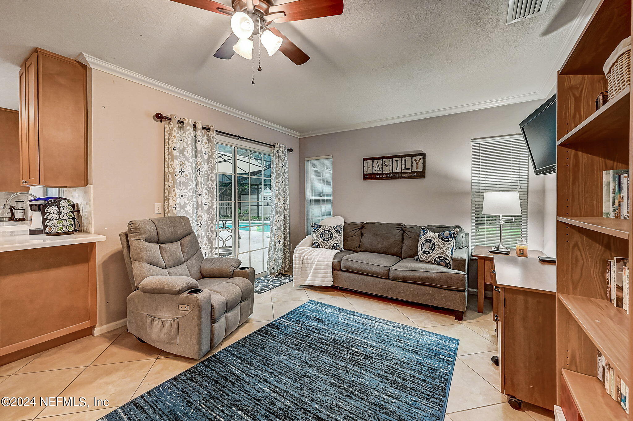1130 Linwood Loop St. Johns, FL 32259 - Photo 20 of 34 a living room with furniture and a large window