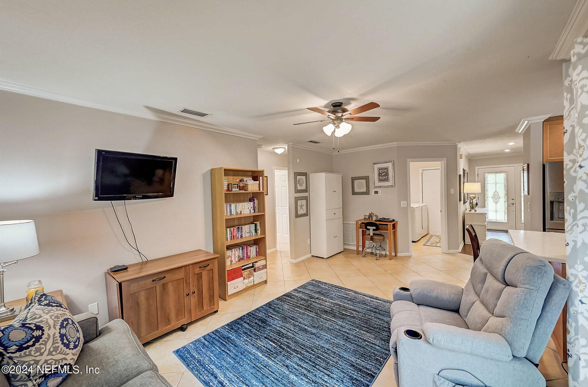 1130 Linwood Loop St. Johns, FL 32259 - Photo 21 of 34 a living room with furniture and a flat screen tv