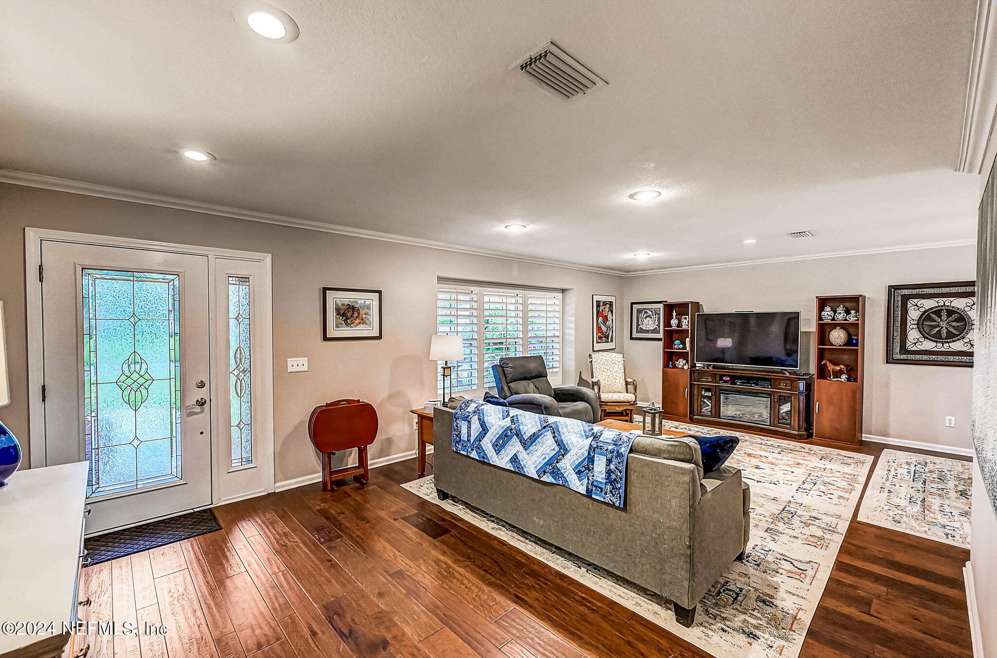 1130 Linwood Loop St. Johns, FL 32259 - Photo 29 of 34 a living room with furniture and a wooden floor