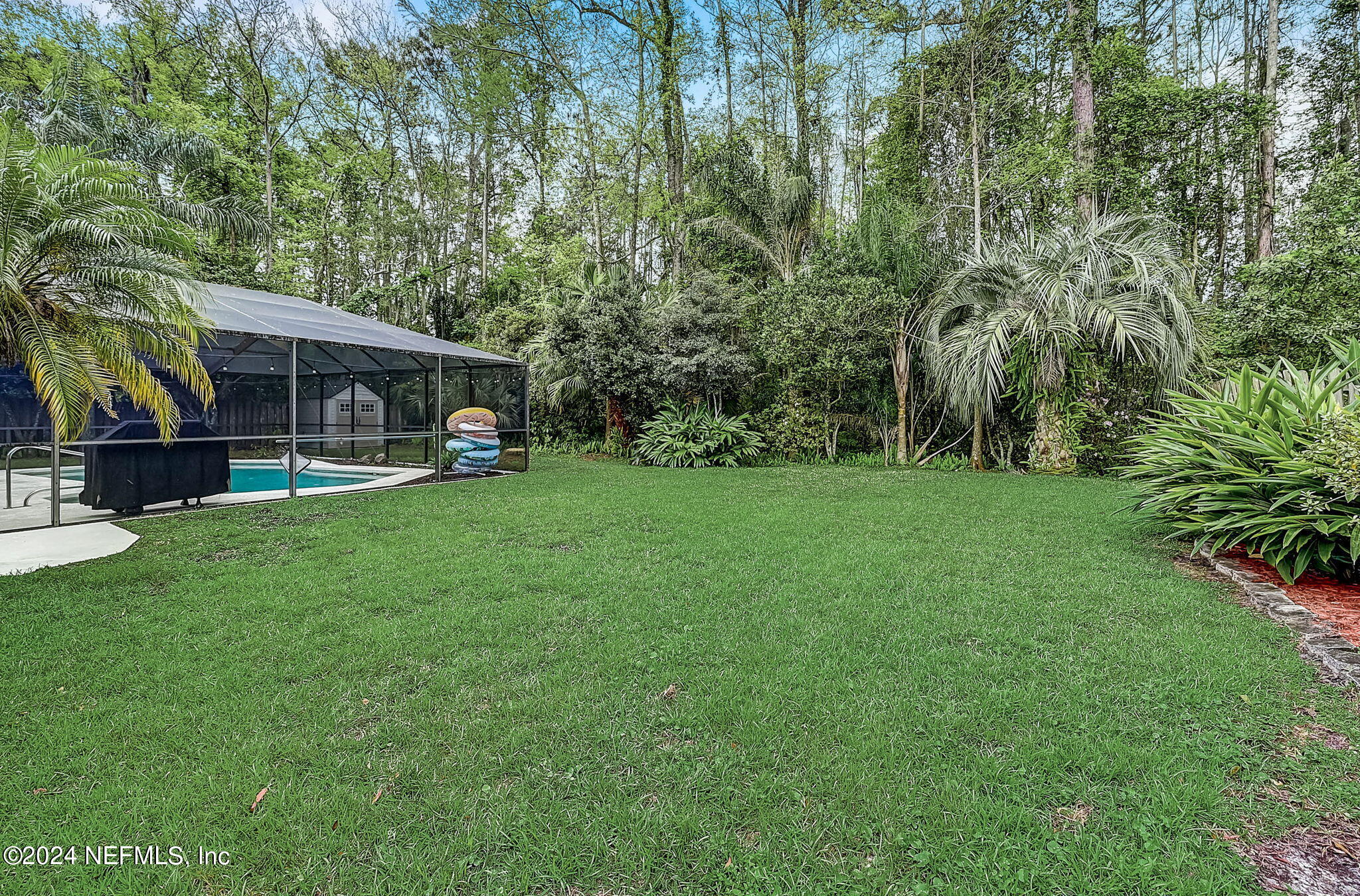 1130 Linwood Loop St. Johns, FL 32259 - Photo 33 of 34 a view of a house with a yard porch and sitting area