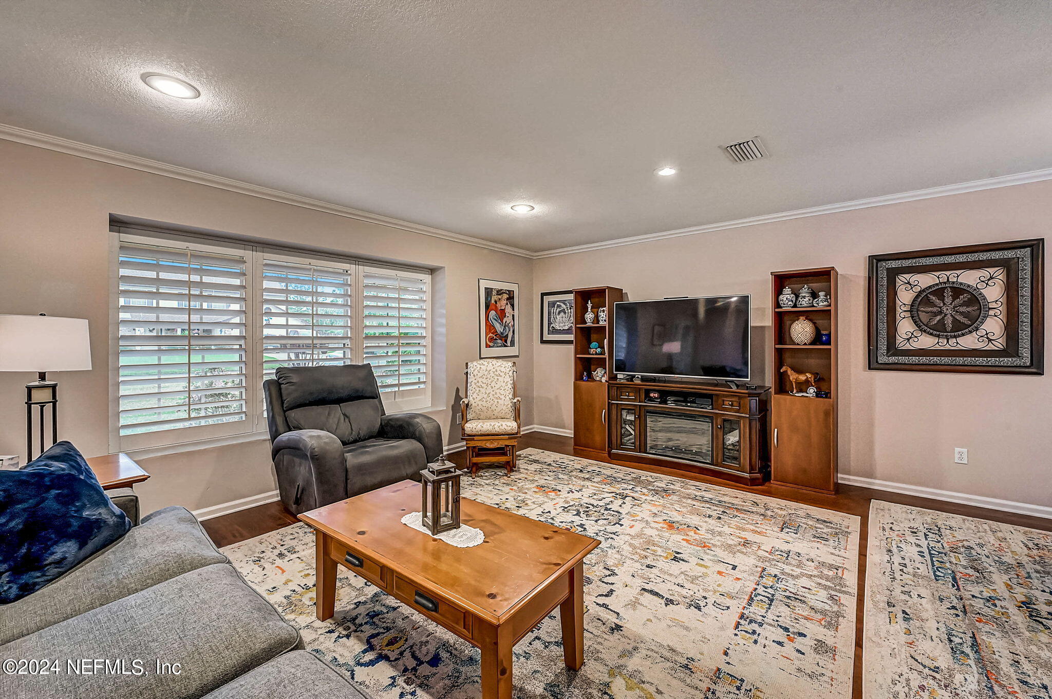 1130 Linwood Loop St. Johns, FL 32259 - Photo 4 of 34 a living room with furniture and a flat screen tv