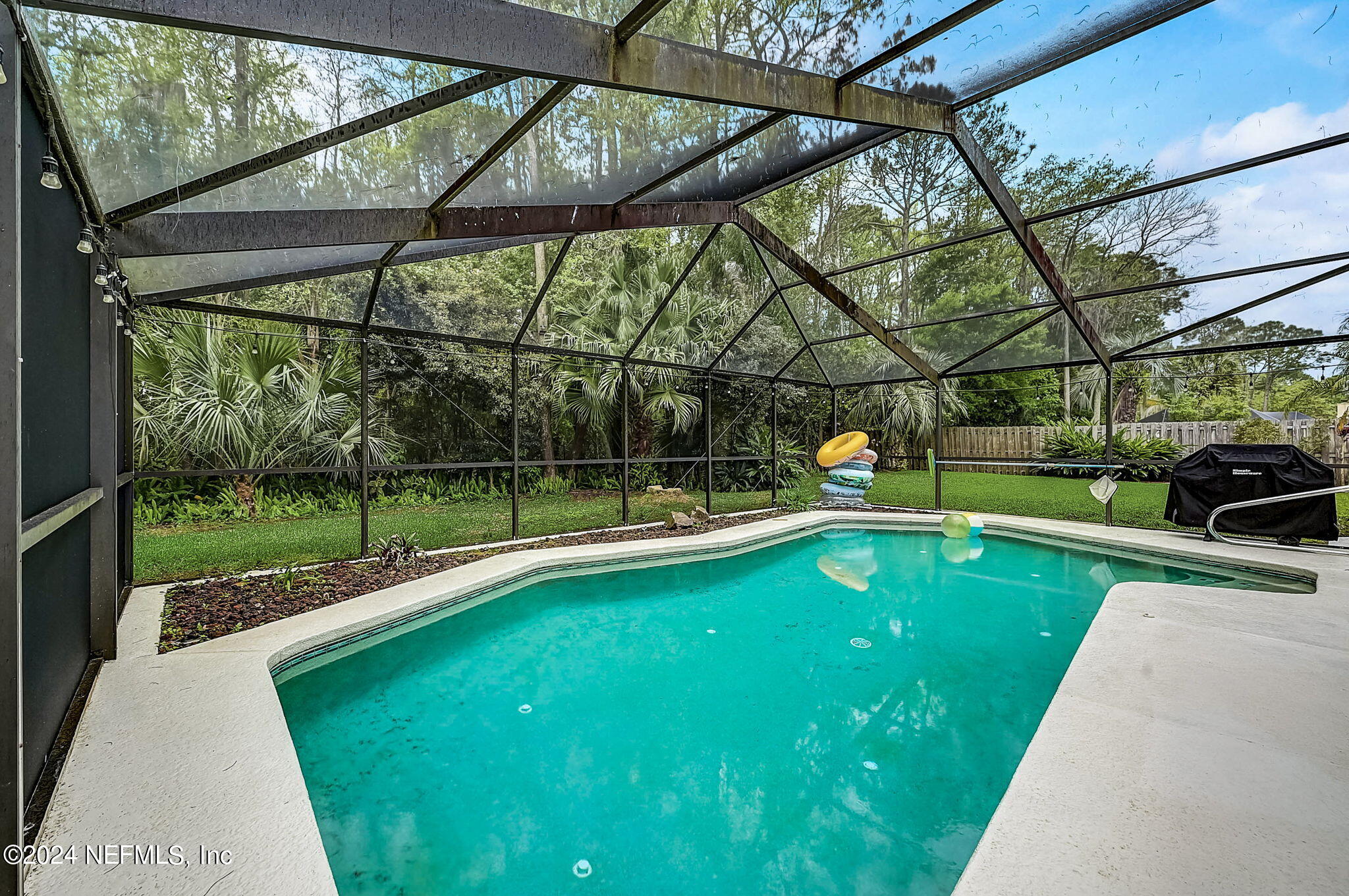 1130 Linwood Loop St. Johns, FL 32259 - Photo 6 of 34 a view of a swimming pool with a porch