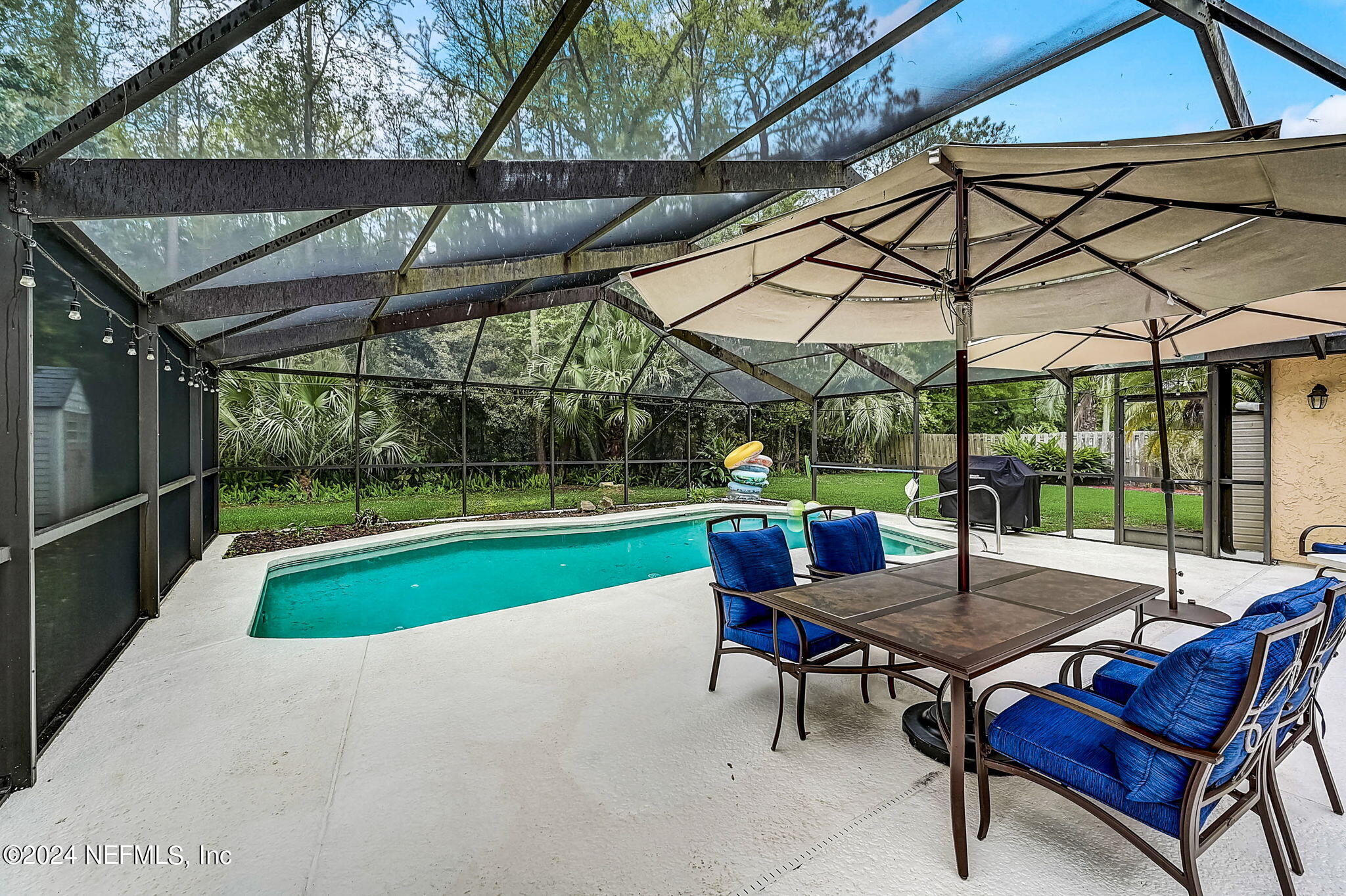1130 Linwood Loop St. Johns, FL 32259 - Photo 7 of 34 a backyard of a house with wooden floor and outdoor seating