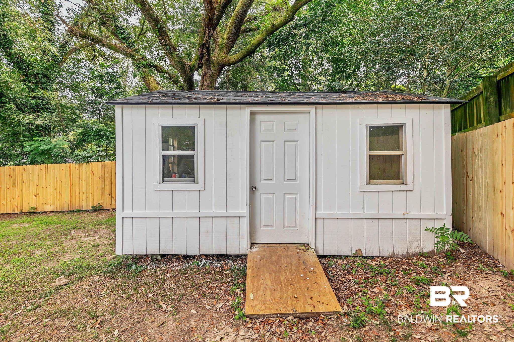 4705 Sherry Court Mobile, AL 36693 - Photo 74 of 100 View of shed with a fenced backyard