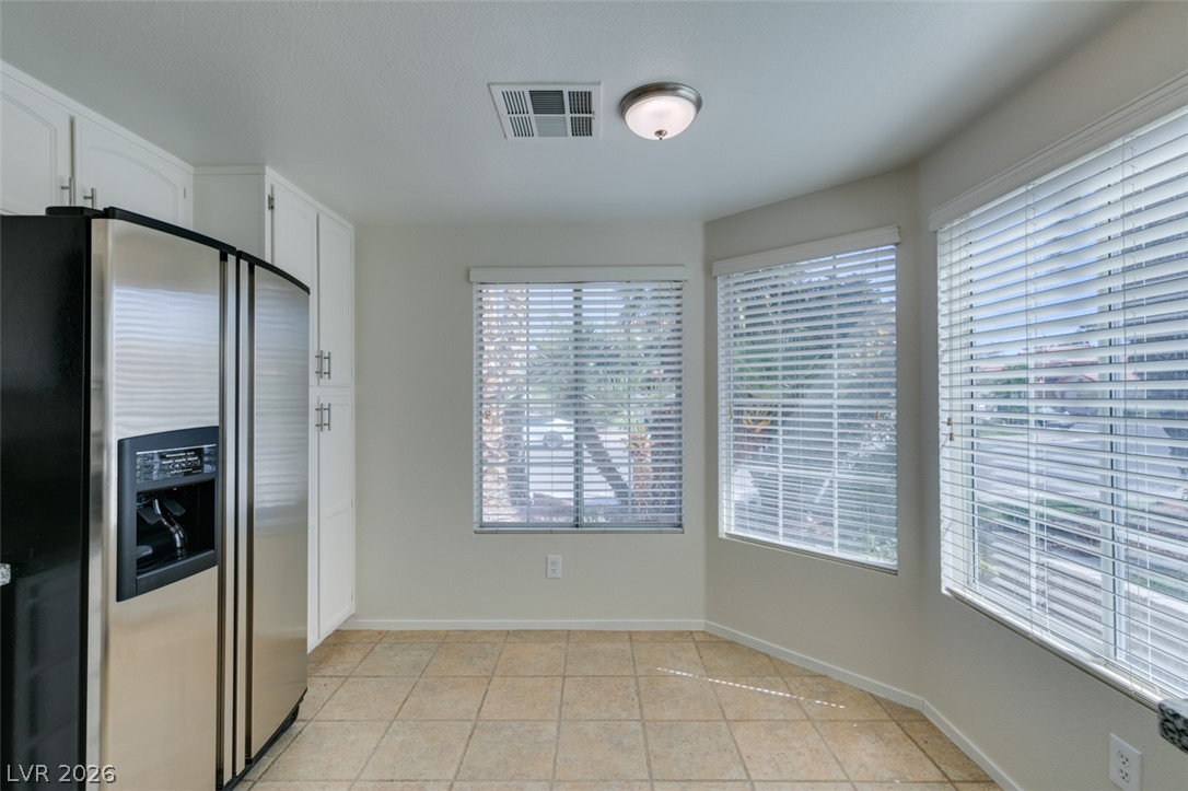 307 Cavalla Street Henderson, NV 89074 - Photo 24 of 44 Well-lit kitchen corner featuring ample cabinetry and a practical tiled floor.