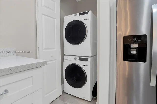 a kitchen with a table and chairs