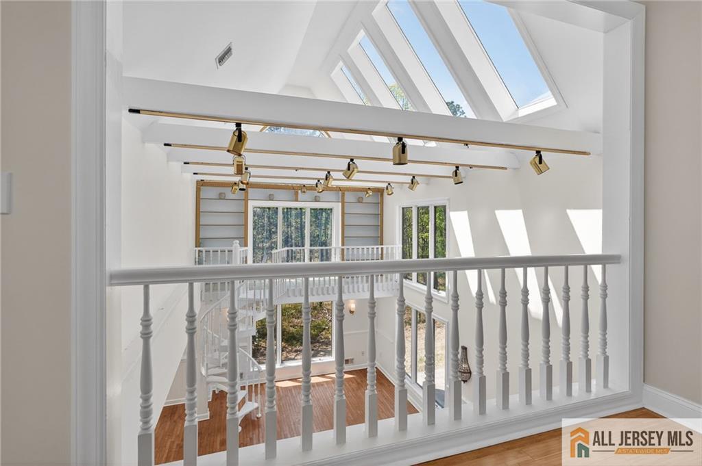 381 Monmouth Road Freehold, NJ 07728 - Photo 46 of 63 a view of staircase with railing and white walls