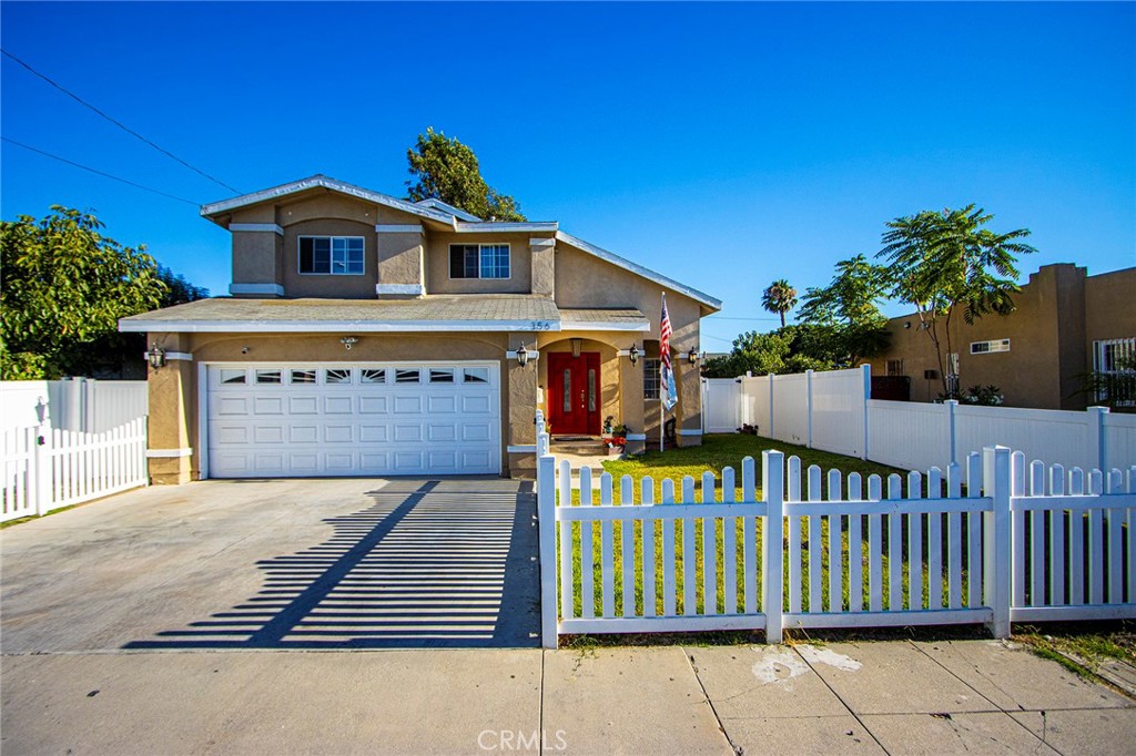 356 West Elm Street Compton, CA 90220 - Photo 1 of 1 a front view of a house with garden