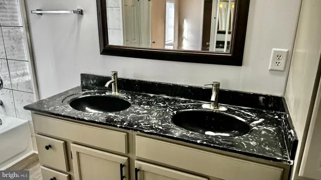 a kitchen with a sink and a stove