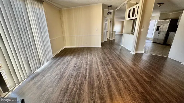 a view of entryway with wooden floor