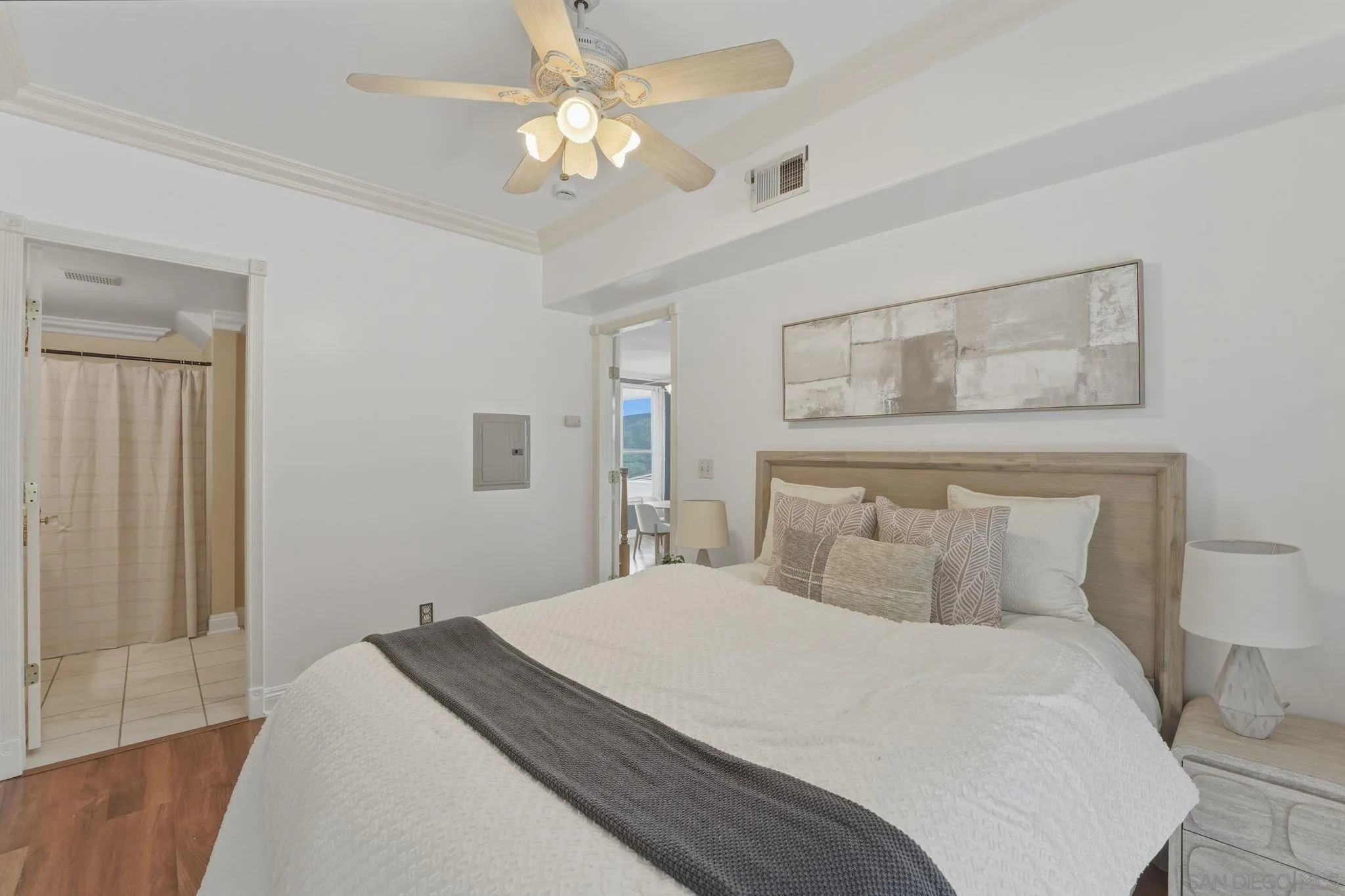 1650 Cuyamaca Avenue Spring Valley, CA 91977 - Photo 22 of 35 a bedroom with a bed and a chandelier