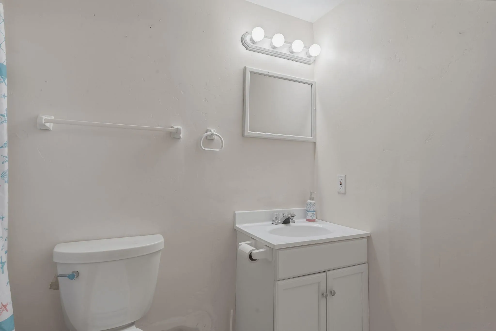 1650 Cuyamaca Avenue Spring Valley, CA 91977 - Photo 25 of 35 a bathroom with a toilet a sink and mirror