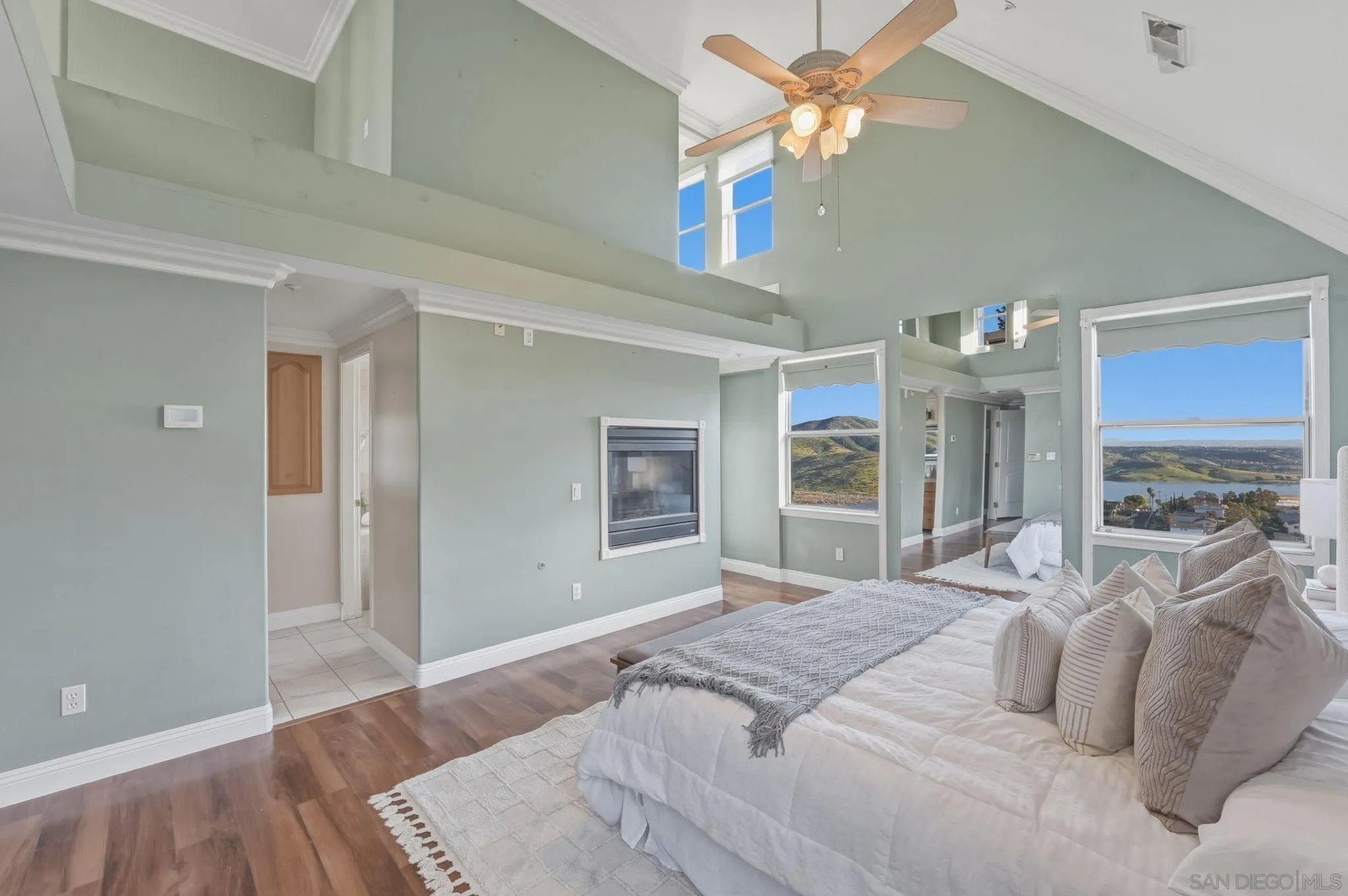 1650 Cuyamaca Avenue Spring Valley, CA 91977 - Photo 3 of 35 a bedroom with a large bed and a chandelier